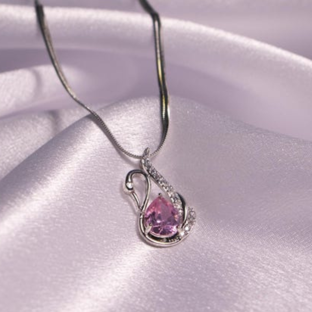 Silver necklace with a pink swan-shaped pendant