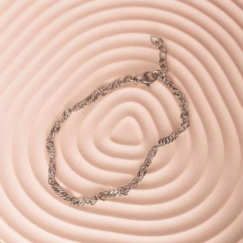 silver anklet featuring a sleek twisted chain